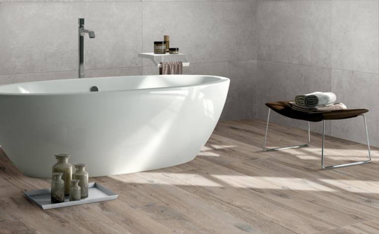 wood look tile flooring in bathroom with bathtub