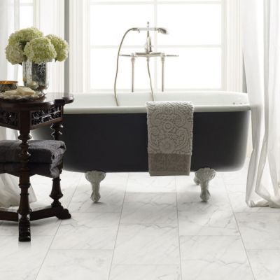 white tile floors in an elegant Irvine, CA, bathroom with large windows